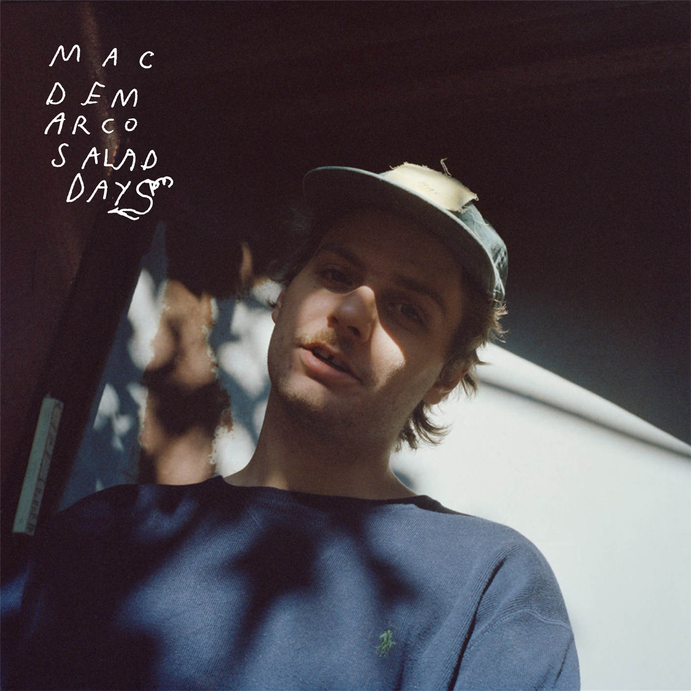 mac demarcosong with vacuum cleaner in background